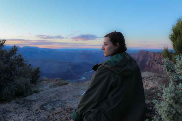 woman wearing brown jacket
